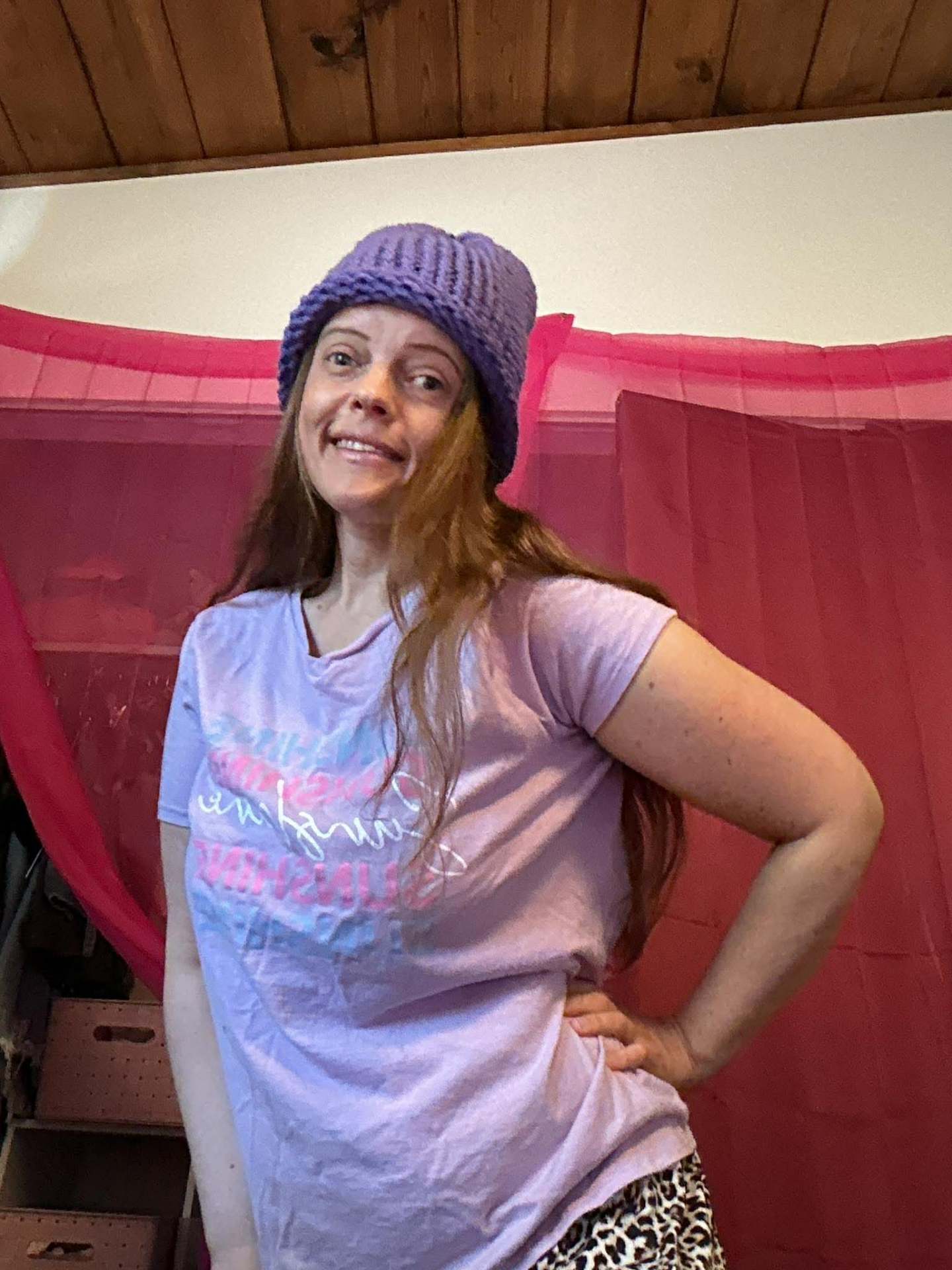 Kailye in a hand-knit lavender beanie